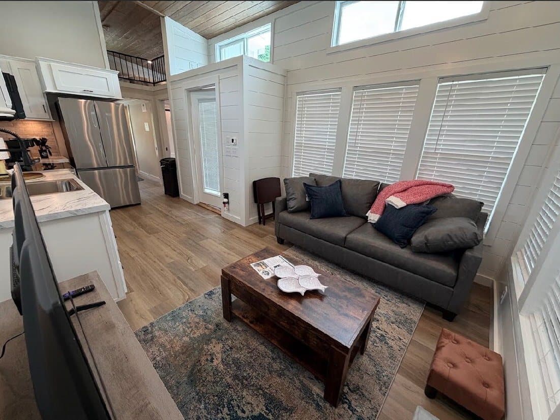 Living room and kitchen in a Riverbend home, set up for a long stay