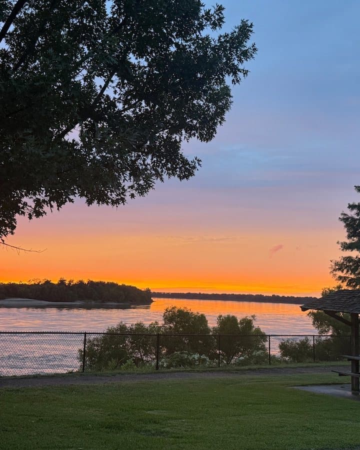 Orange sunset over the Mississippi from the lawn at MS Riverbend