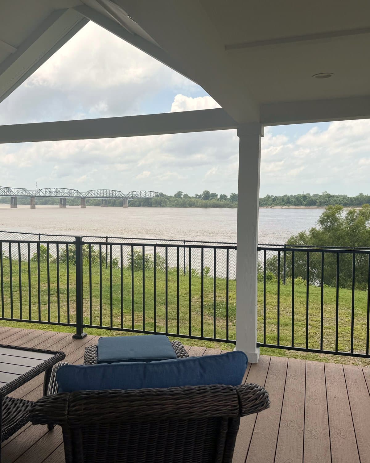 Covered porch at Magnolia looking across the lawn to the Mississippi and the Vicksburg bridge